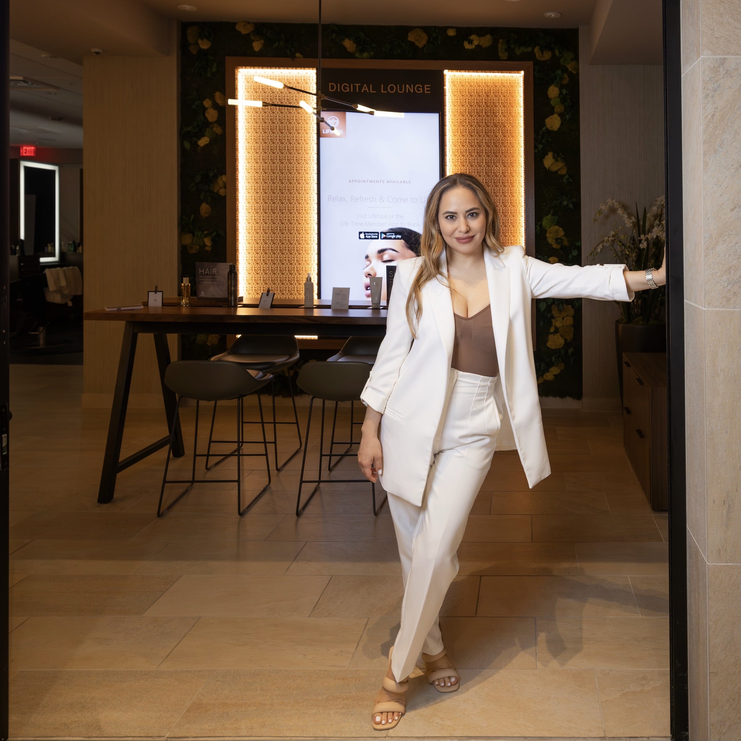 Portrait of Karla Stein in a white suit